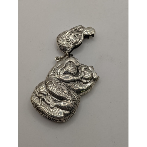 70 - A sterling silver vesta case in the form of a dragon with embossed detail, total weight 31.5g, Locat... 