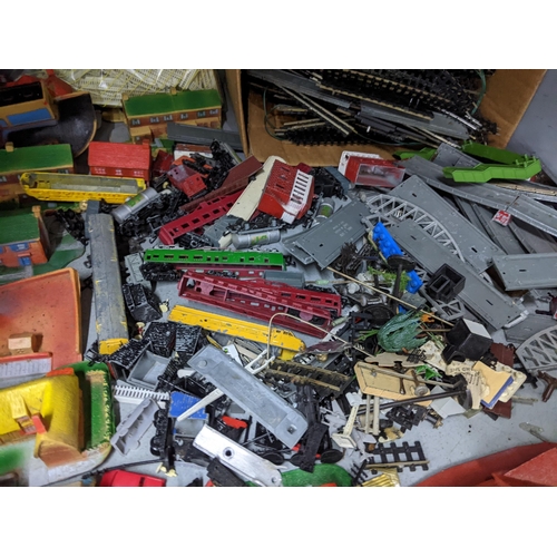 376 - A mixed lot of toys to include Hornby 00 gauge, Lone Star Eaglet series buildings and train accessor... 