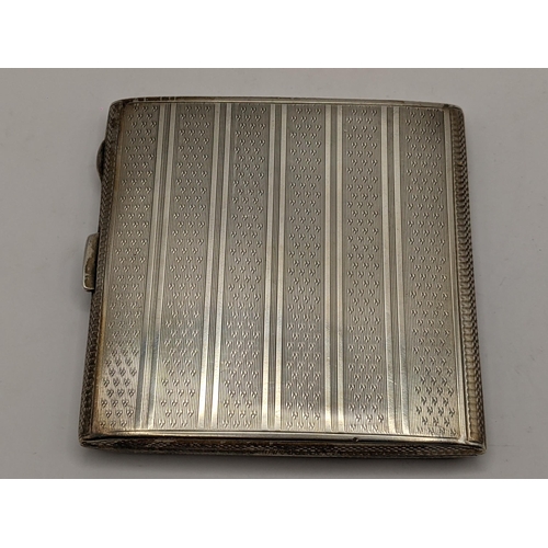 111 - An early 20th century silver cigarette case with initials to the front, hallmarked Birmingham 1923, ... 