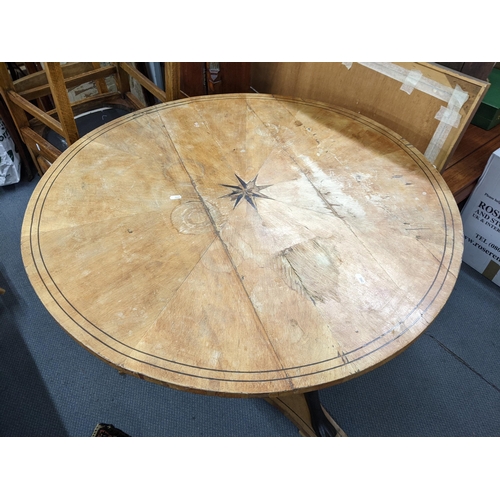 146 - A 19th century Scandinavian satinwood circular topped, two tier table having marquetry inlay and lio... 