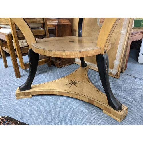 146 - A 19th century Scandinavian satinwood circular topped, two tier table having marquetry inlay and lio... 