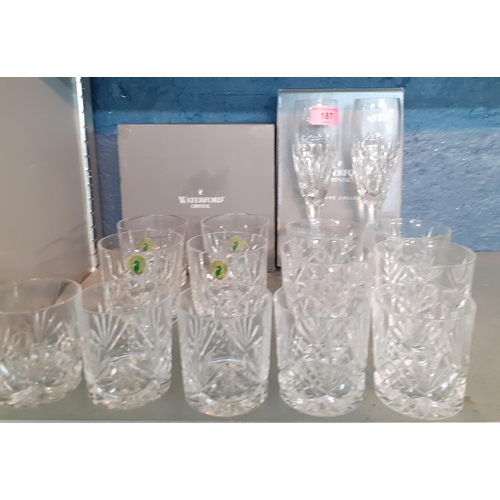 187 - A set of four Waterford Lismore tumblers with original box, mixed tumblers and a pair of Waterford N... 