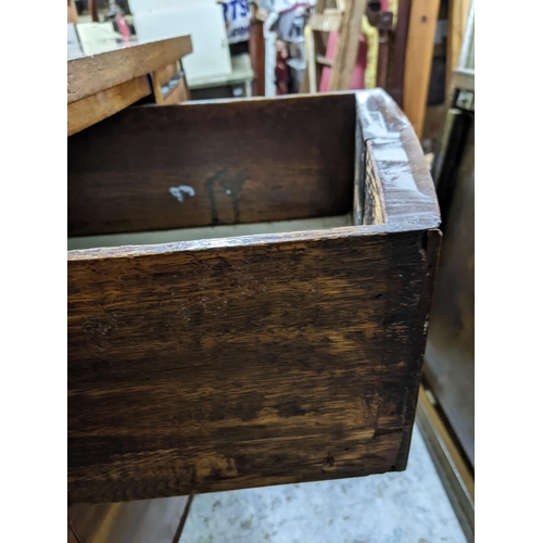 202 - A Georgian mahogany bow fronted kneehole sideboard with brass top rail, inlaid stringing, later bras... 