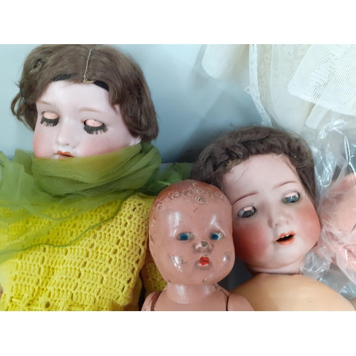 232 - An Armand Marseilles doll, together with a Heubach Hoppelsdorf doll A/F, a small vintage baby doll, ... 