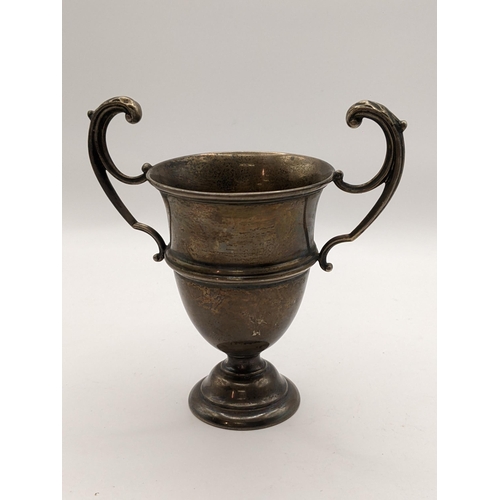 24 - An early 20th century silver twin handled small trophy with engraving, 72.8g, Location:TABLE