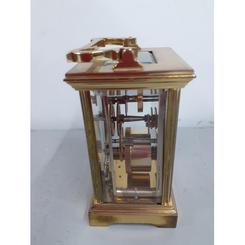 272 - A St James five window brass cased carriage clock with key, Location: R2:1