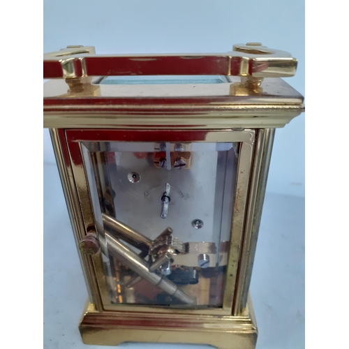 272 - A St James five window brass cased carriage clock with key, Location: R2:1