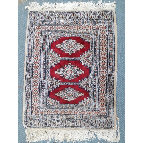 289 - A 20th century blue and brown ground rug together with a small cream scatter/pray
Location:STAIRS