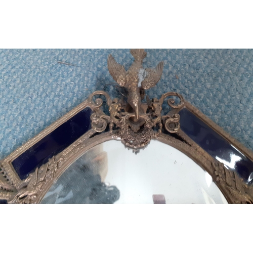 327 - A 1930's French brass and blue glazed pottery wall mirror with two incorporated candle holders
Locat... 