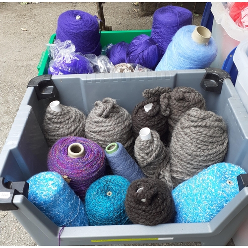 338 - A large quantity of wool to include knitting machine wool and partial knitting projects, all housed ... 