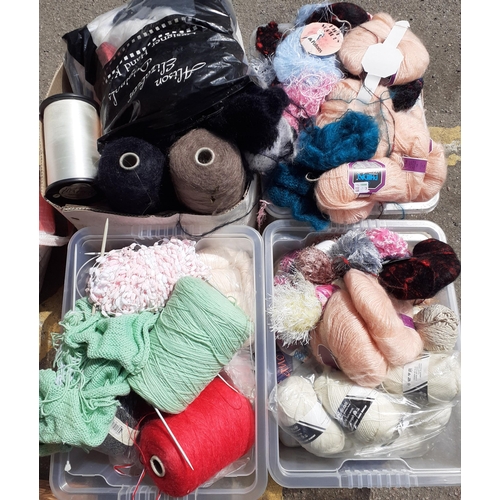 338 - A large quantity of wool to include knitting machine wool and partial knitting projects, all housed ... 