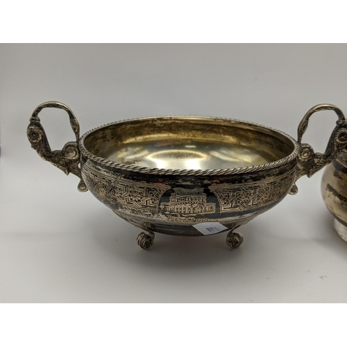 34 - A white metal twin handled bowl, together with a white metal basket, both stamped to the base, 389.9... 