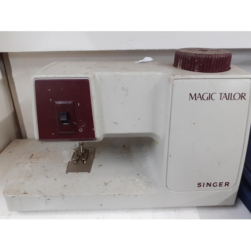 344 - Two sewing machines to include a Toyota electric sewing machine and a vintage Singer Magic Tailor se... 