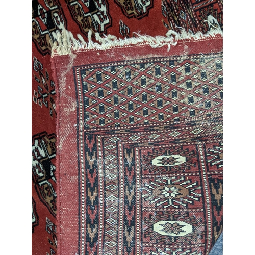 288 - A red 20th century rug having elephant gull design, 180cm x 128cm
Location:BR