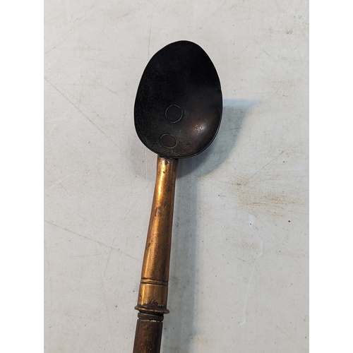 331 - A copper ladle with a turned wooden handle
Location:LWM