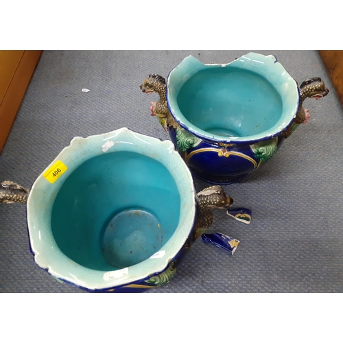 318 - A pair of Majolica planters having a blue ground with green, yellow and brown acanthus and serpent d... 