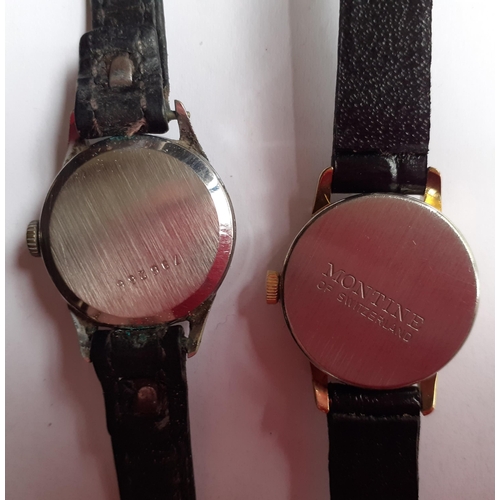 324 - A mixed lot to include two vintage ladies watches on black leather straps to comprising a silver ton... 