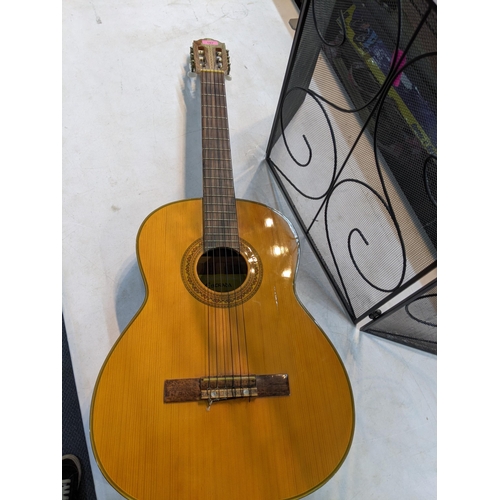 167 - A Estrada acoustic guitar together with a small folding fine surround
Location:LWR