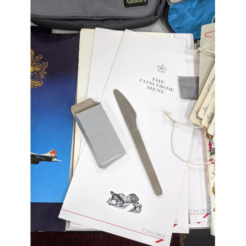 175 - A collection of Concorde and British Airways items to include The Concorde menu, British Airways lug... 