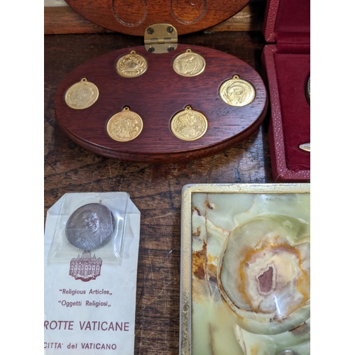 219 - Eight hundred continental silver letter opener and magnifying set, cased with commemorative coins to... 