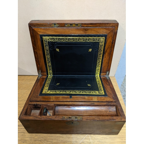 223 - A Victorian walnut box writing slope with fitted interior and a Victorian oak stationery box with ke... 