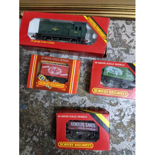 224 - A Hornby model railway train set with Caledonian Railway engine and three carriages with track and a... 