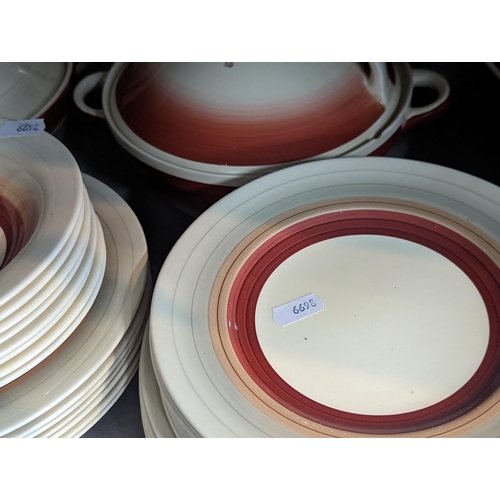 234 - A group of Susie Cooper red wedding band items to include plates, bowls, tureens, jug and others
Loc... 