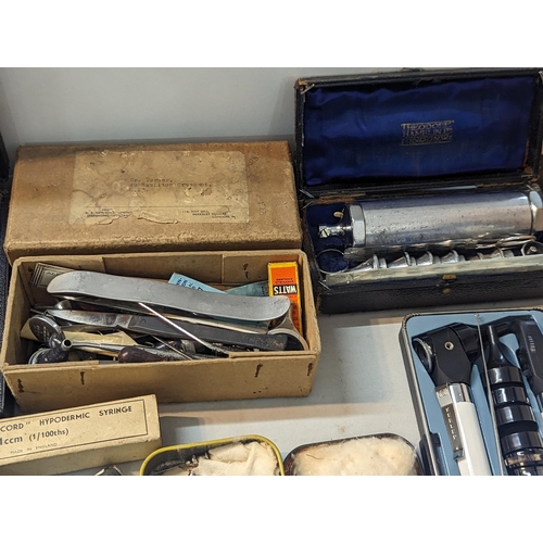 240 - A large quantity of doctors items and related to include stethoscope, otoscope, hypodermic needles, ... 