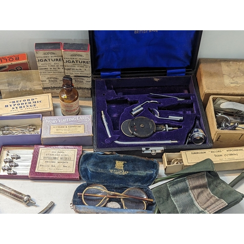 240 - A large quantity of doctors items and related to include stethoscope, otoscope, hypodermic needles, ... 