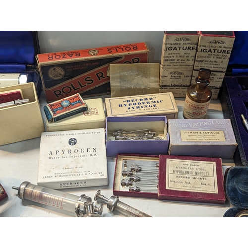 240 - A large quantity of doctors items and related to include stethoscope, otoscope, hypodermic needles, ... 