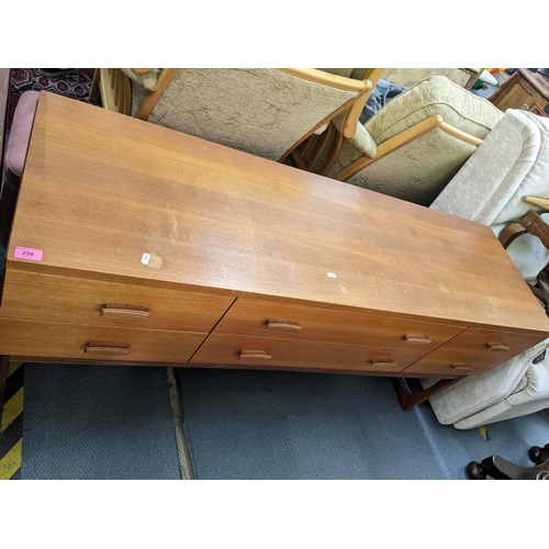 258 - A retro teak sideboard having two long drawers flanked by four short drawers, 71h x 15w, Location:LA... 