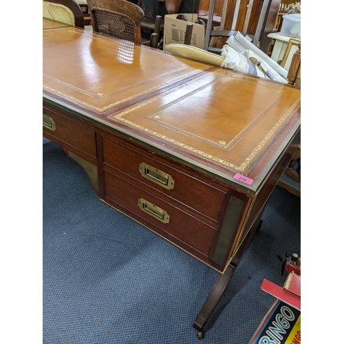 270 - A campaign style mahogany and brass mounted desk having a  leather topped scriber, sic drawers and f... 