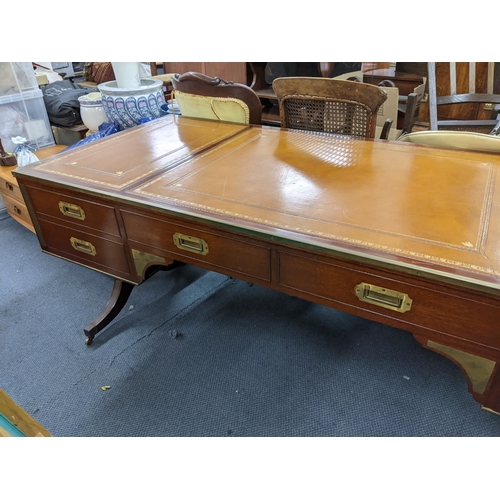 270 - A campaign style mahogany and brass mounted desk having a  leather topped scriber, sic drawers and f... 