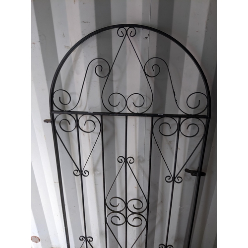 298 - A wrought metal, black painted garden gate having an arched top and scrollwork frame, 167.5h x 86w, ... 