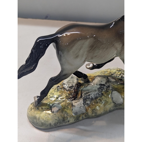 317 - A Beswick model of Przewalski's Wild Horse, dated 1005, limited edition no 684/1000, together with b... 