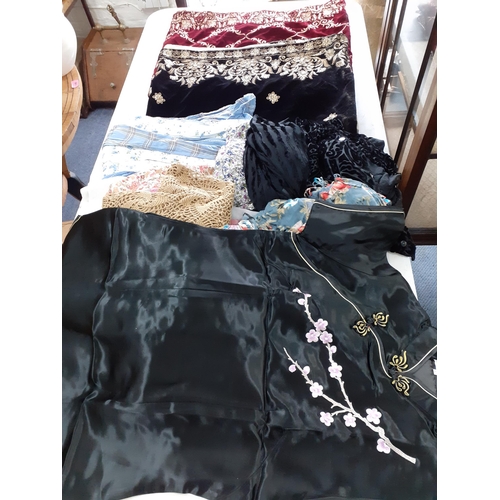 334 - A quantity of vintage lace tablecloths, mainly 1960's-1970's together with  knitwear and clothing, t... 