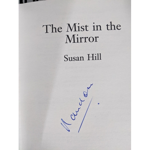 374 - A collection of books on ghosts, novels, witches and other related books to include Susan Hill novel... 