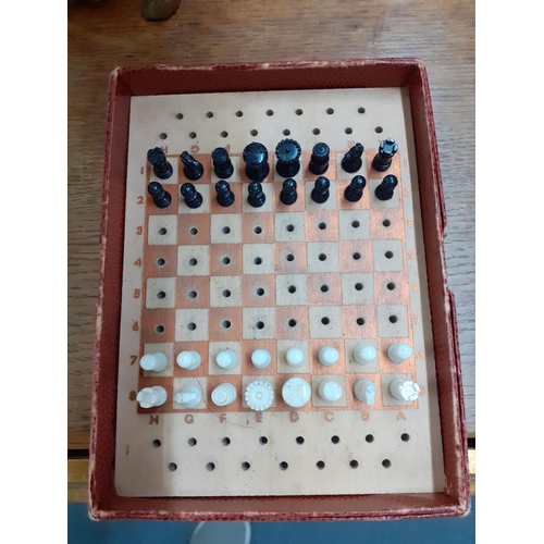 389 - An Alice in Wonderland style composition chess set, together with a playing card storage box, a smal... 