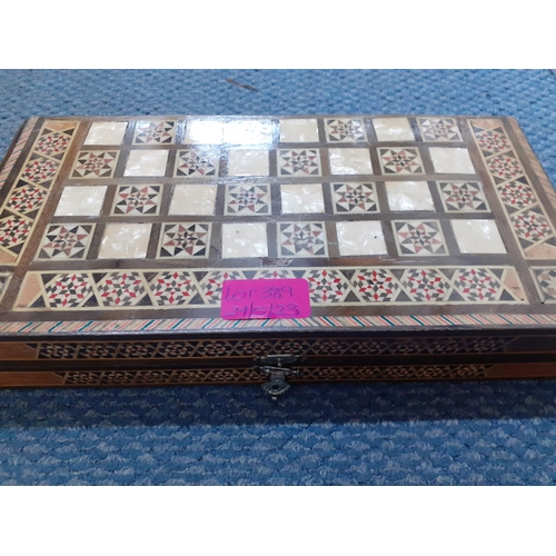 389 - An Alice in Wonderland style composition chess set, together with a playing card storage box, a smal... 