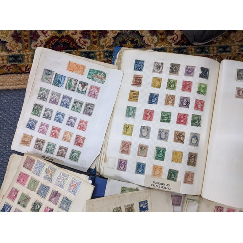 499 - Three albums and loose pages of 19th century and later mixed stamps from around the world to include... 