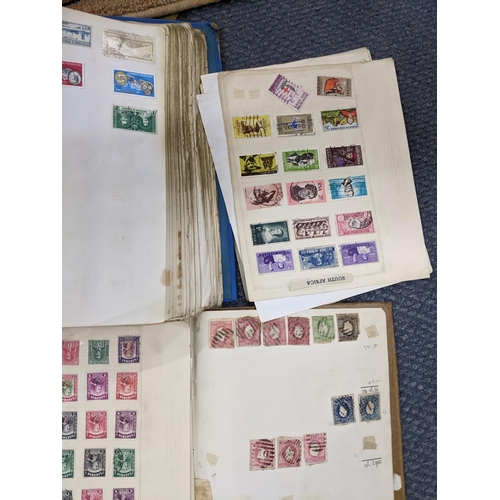 499 - Three albums and loose pages of 19th century and later mixed stamps from around the world to include... 