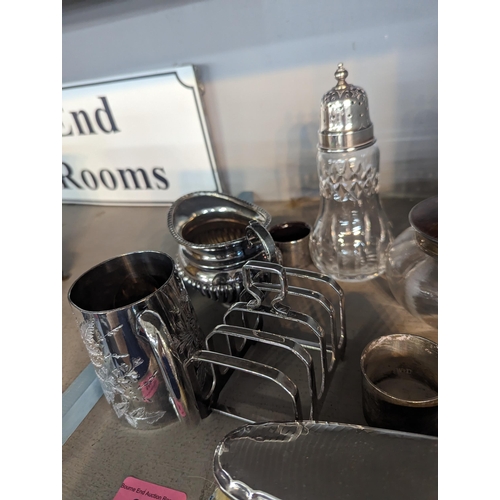 399 - Silver to include a sugar caster, brush dressing table pot, a napkin ring and silver plate
Location:... 