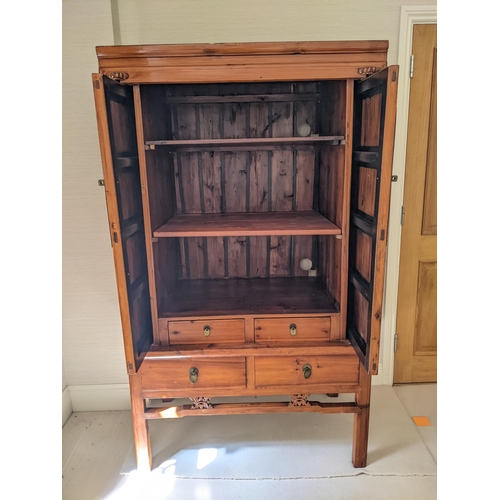 270 - A Chinese elm marriage style cabinet with hinged and sliding doors, enclosing shelves and two drawer... 