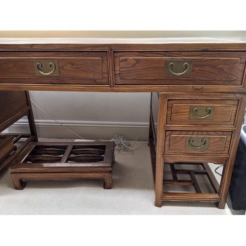 278 - A Chinese elm desk in three parts with three in line drawers, each pedestal containing two drawers a... 