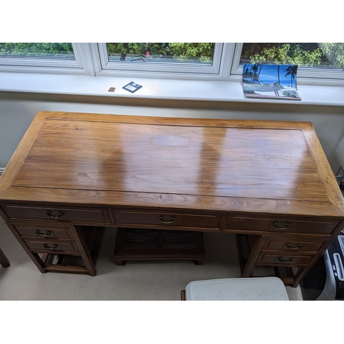 278 - A Chinese elm desk in three parts with three in line drawers, each pedestal containing two drawers a... 