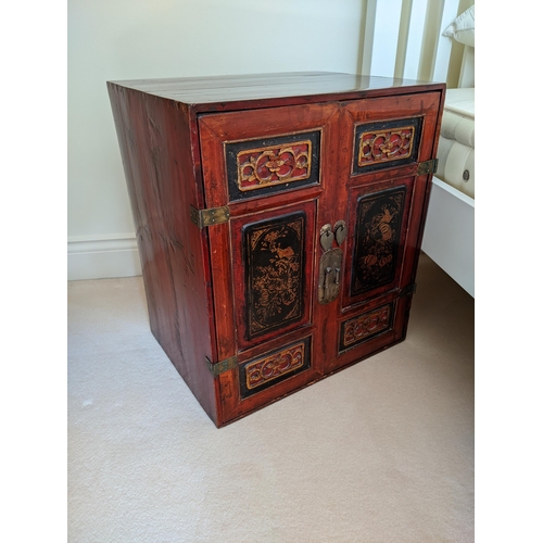 288 - A pair of Chinese red and gold lacquered cabinets, each with a pair of panelled doors, 57cm high,  5... 