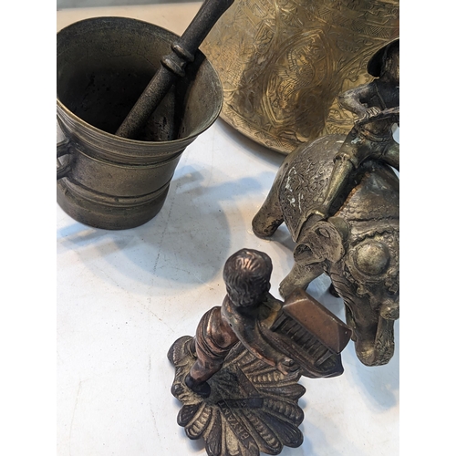 375 - Brassware to include Egyptian engraved pot, an Asian model of a boy on an elephant, a pestle and mor... 