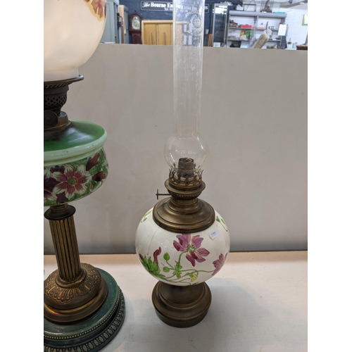 101 - A late 19th/early 20th century oil lamp together with two others along with a brass lamp
Location:RO... 