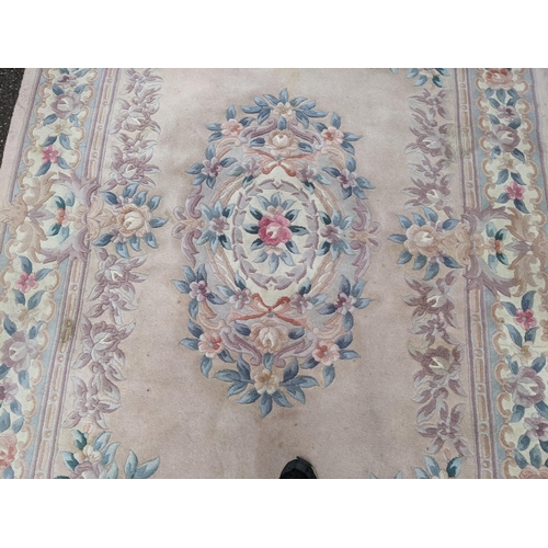 113 - A Chinese rug having a central motif and a floral design, 250cm x 171cm
Location:G