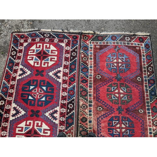 114 - A matched pair of Persian hand woven runners having a red ground with repeating motifs, 284cm x 72cm... 